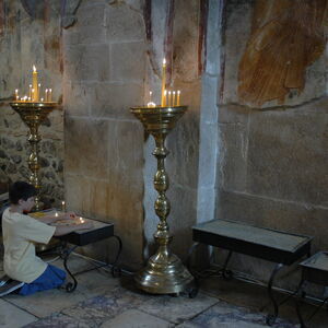 Stefan lighting the candles in the church